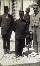 MSG037: Durrës: Italian officials: Captain Fortunato Castoldi [l.], Admiral Eugenio Trifari and Baron Carlo Aliotti [holding cane], spring of 1914 (Marquis di San Giuliano Photo Collection).