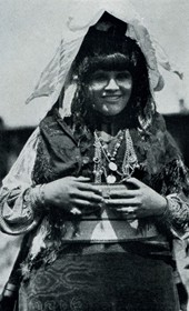 HAB20: “A Highland bride. The bridegroom first sees the bride that his parents have chosen for him when she reaches his house. The young woman is unveiled here” (Photo: Hugo Bernatzik, 1929).