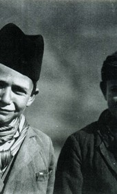“Snapshot of two boys, wearing coats that are a departure from the traditional attire of clans in Mirditë” (Photo: Carleton Coon 1929).