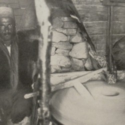 FMG037: A miller working in his mill at Guri i Bardhë, Albania (photo: Friedrich Markgraf, 1924-1928).