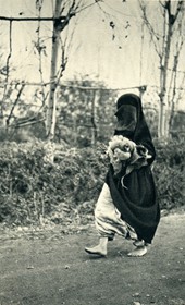 GM008: Woman going to market at Shkodra, veiled but barefooted (Photo: Giuseppe Massani, 1940).