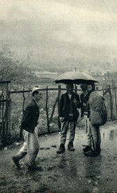 GM032: Men in Boga standing in the rain (Photo: Giuseppe Massani, 1940).