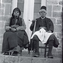 DhV005: An elderly couple on their doorstep. Kolonja, Albania (photo: Dhimitër Vangjeli).