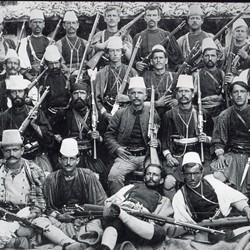 DhV013: The çeta (armed band) of the rebel leader Sali Butka (1857-1938) in 1912. Sali Butka is in the middle with his hand on his belt. Kolonja, Albania (photo: Dhimitër Vangjeli).